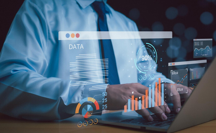 CMMS data management businessman using laptop checking data and analytics