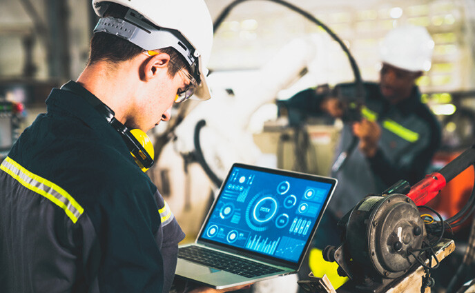 ai enables maintenance management young factory worker working with adept robotic arm