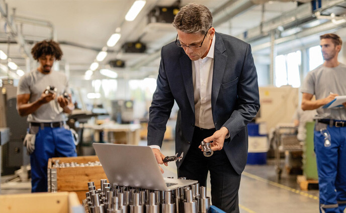 cmms for discrete manufacturing or process manufacturing factory manager checking spare parts