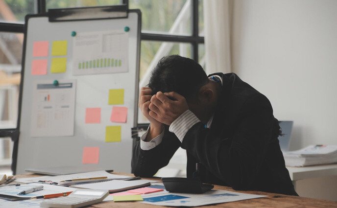 cmms implementation risks stressed tired business accountant man
