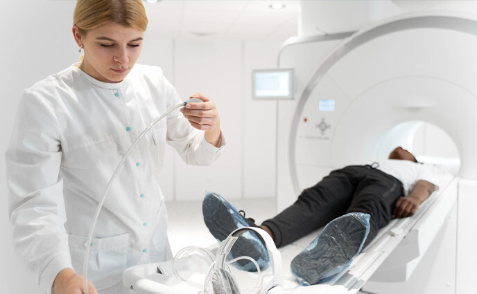 cmms iot industry use cases doctor operating patient on MRI machine