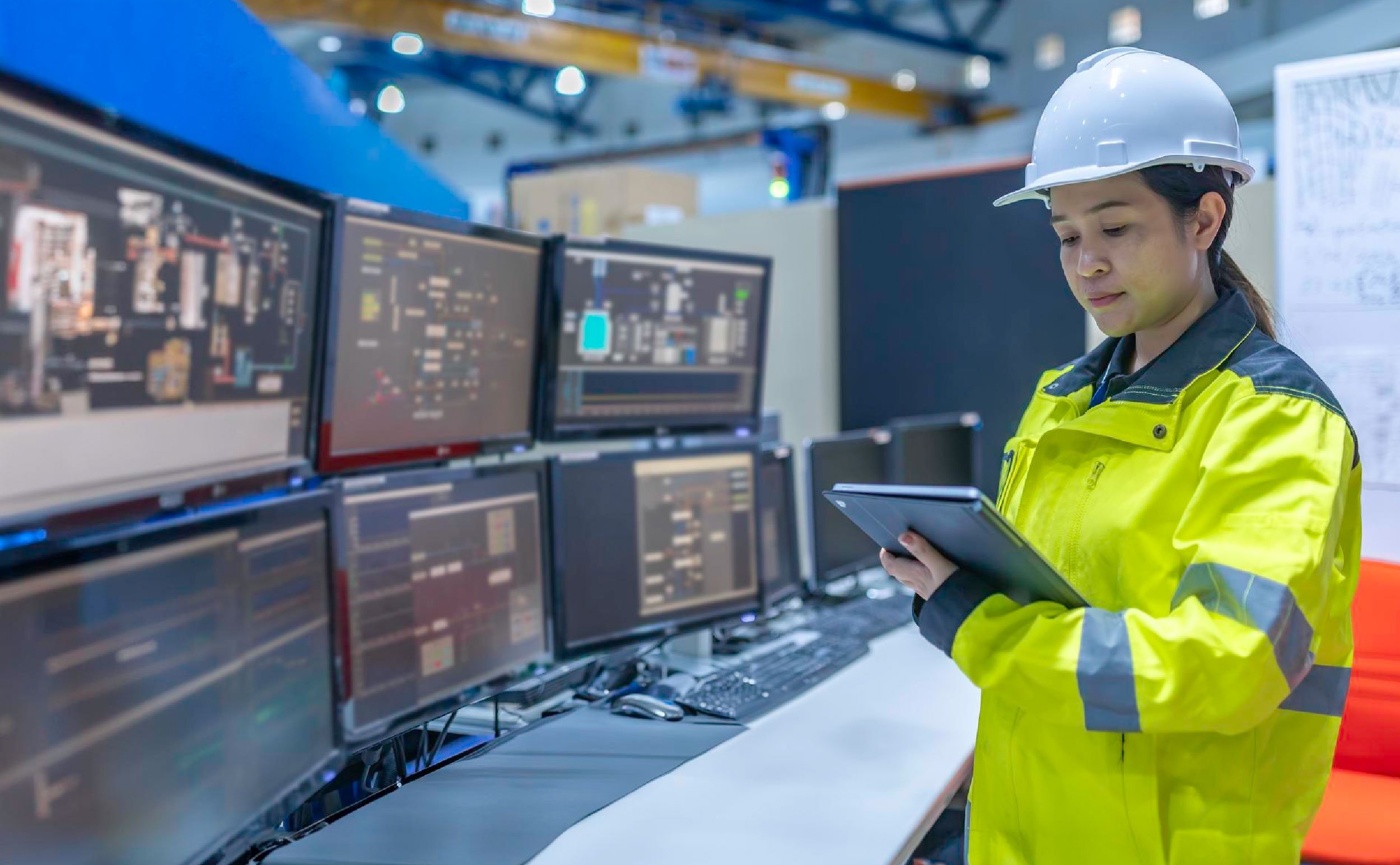 cmms asset metadata inside large industry factory female computer engineer
