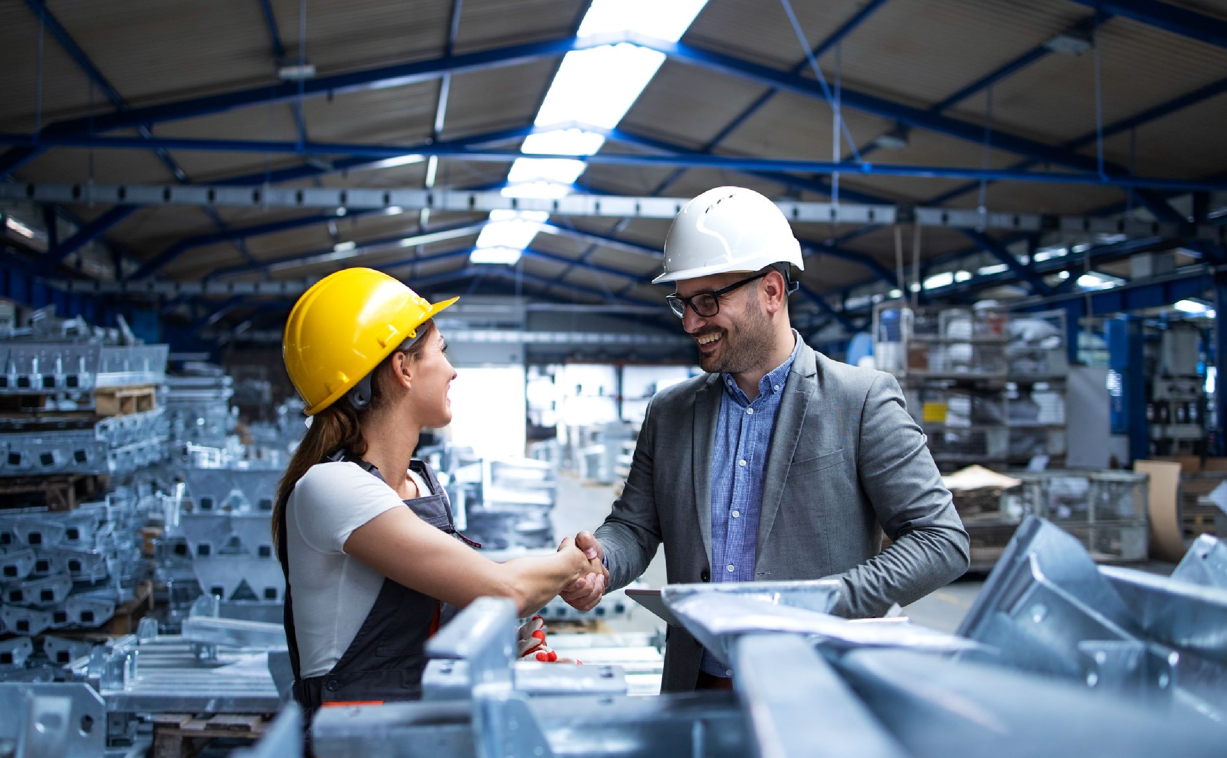 cmms bridges maintenance and production factory manager visiting production line congratulating worker