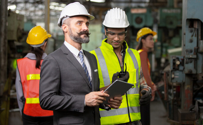 cmms buying process engineer holding digital tablet