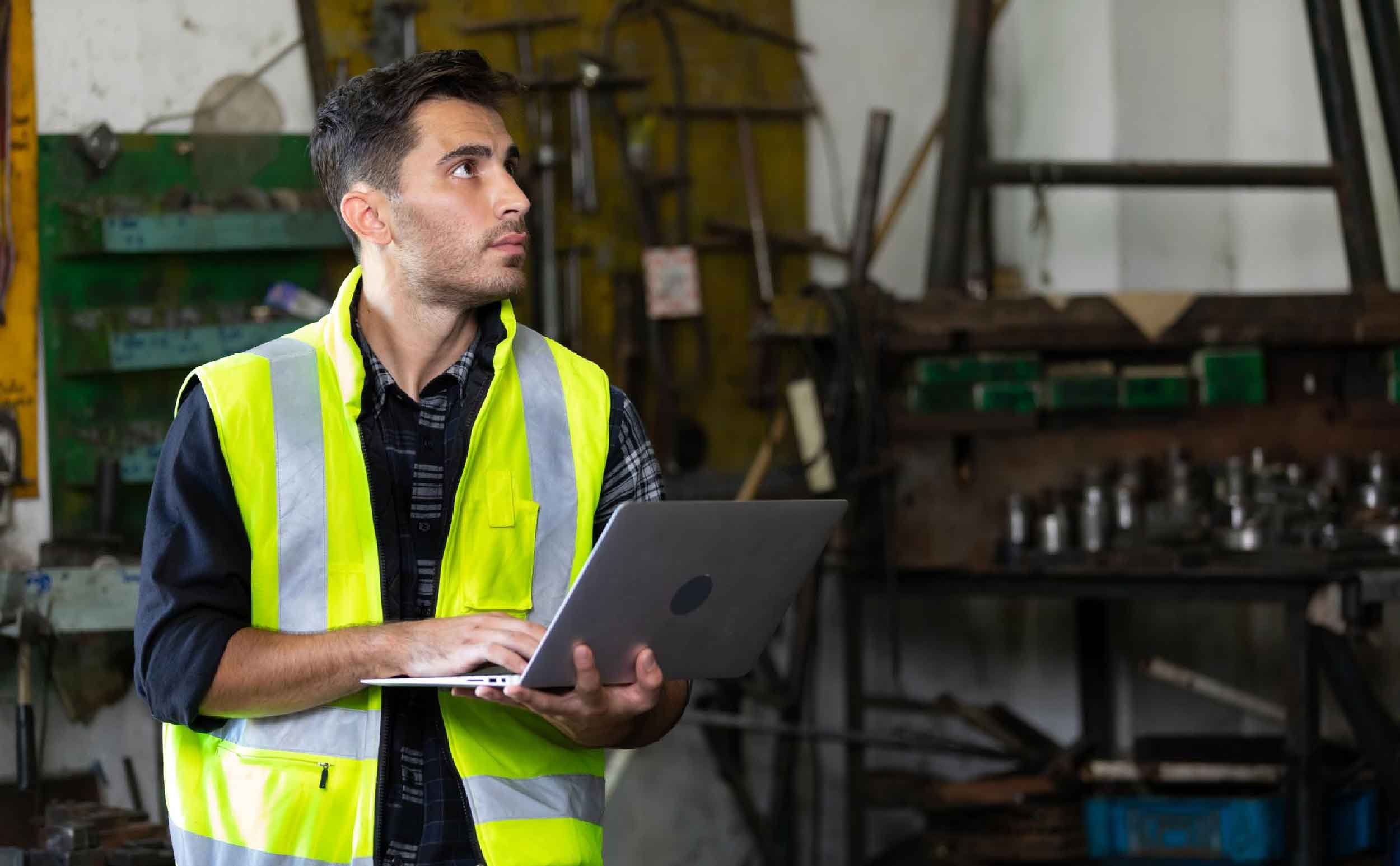 cmms maturity models technician using laptop