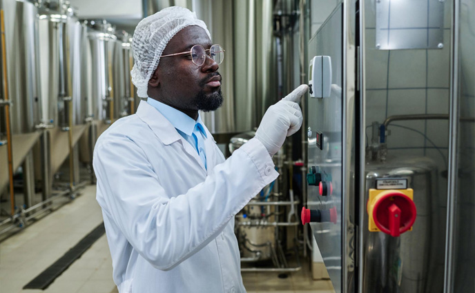 cmms maximizes asset lifespan engineer uniform working machinery