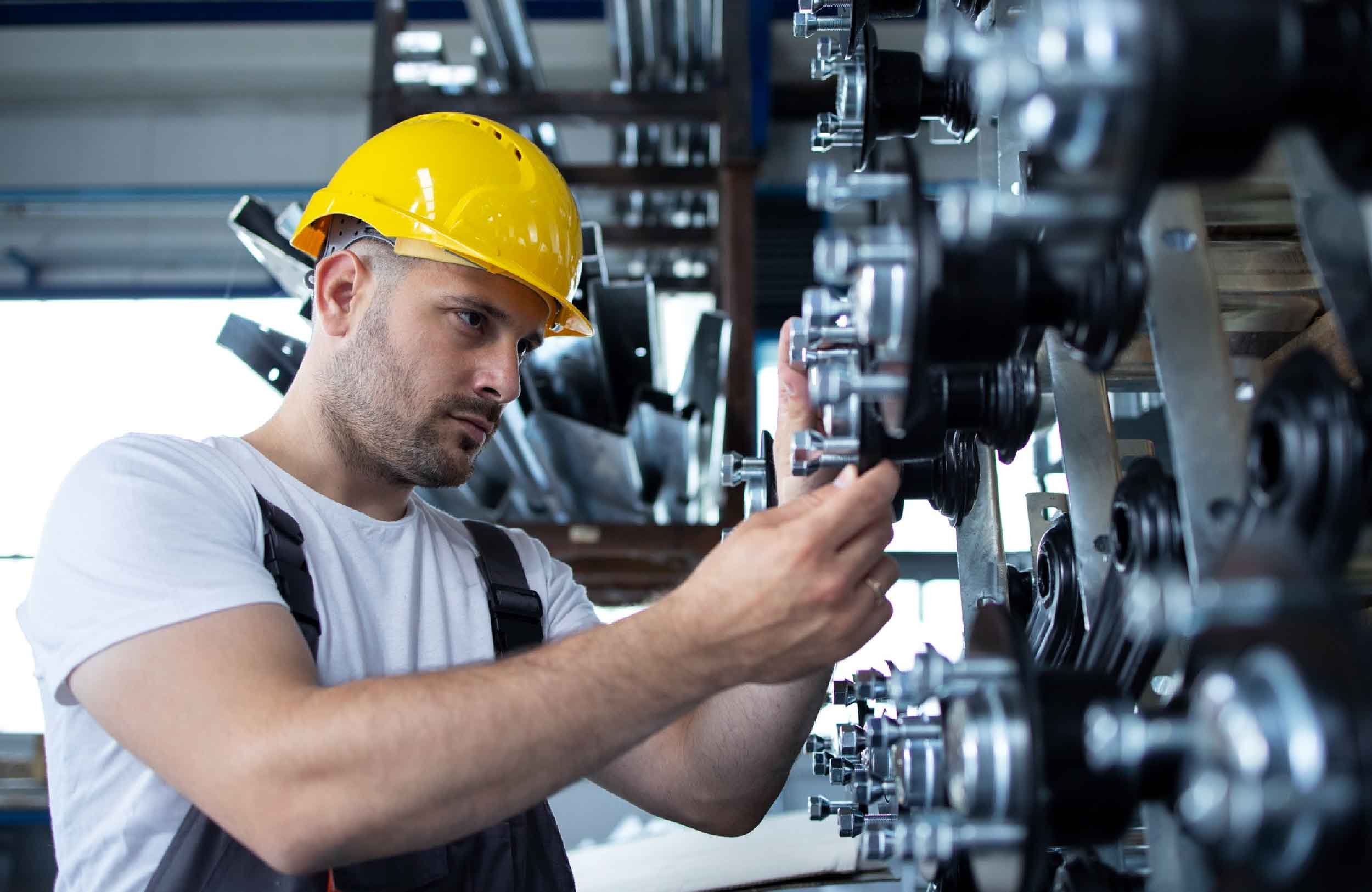 cmms preventive maintenance examples industrial worker working production line factory