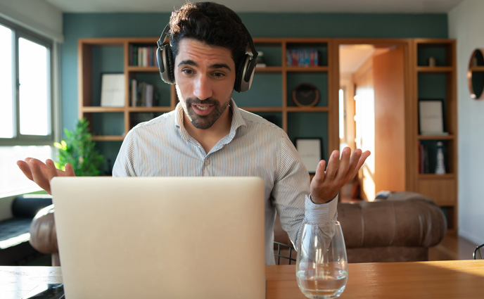 cmms software training young man work video call with laptop