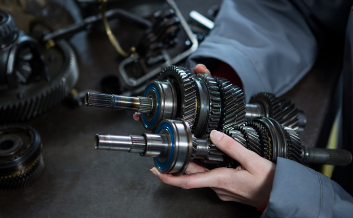 cmms sofware spare parts management mechanic holding spare parts car