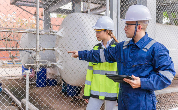 cmms sustainable facility management engineer inspecting in factory