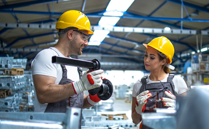 cmms trends 2025 workers checking quality metal parts
