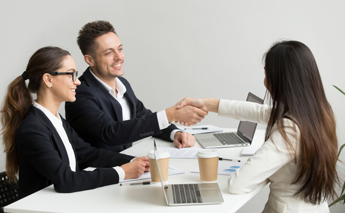 cmms vs eam partners handshaking group meeting
