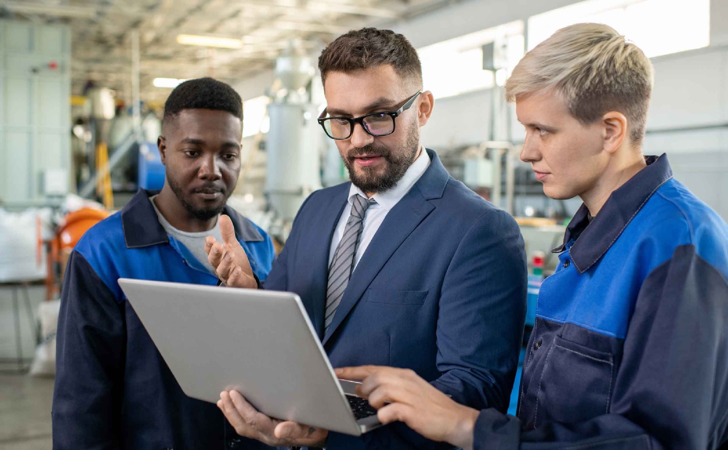 explainable ai cmms group engineers hardhats using digital tablet