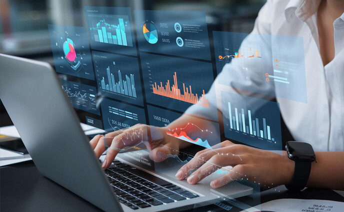 facility management kpis man is typing laptop with graph screen