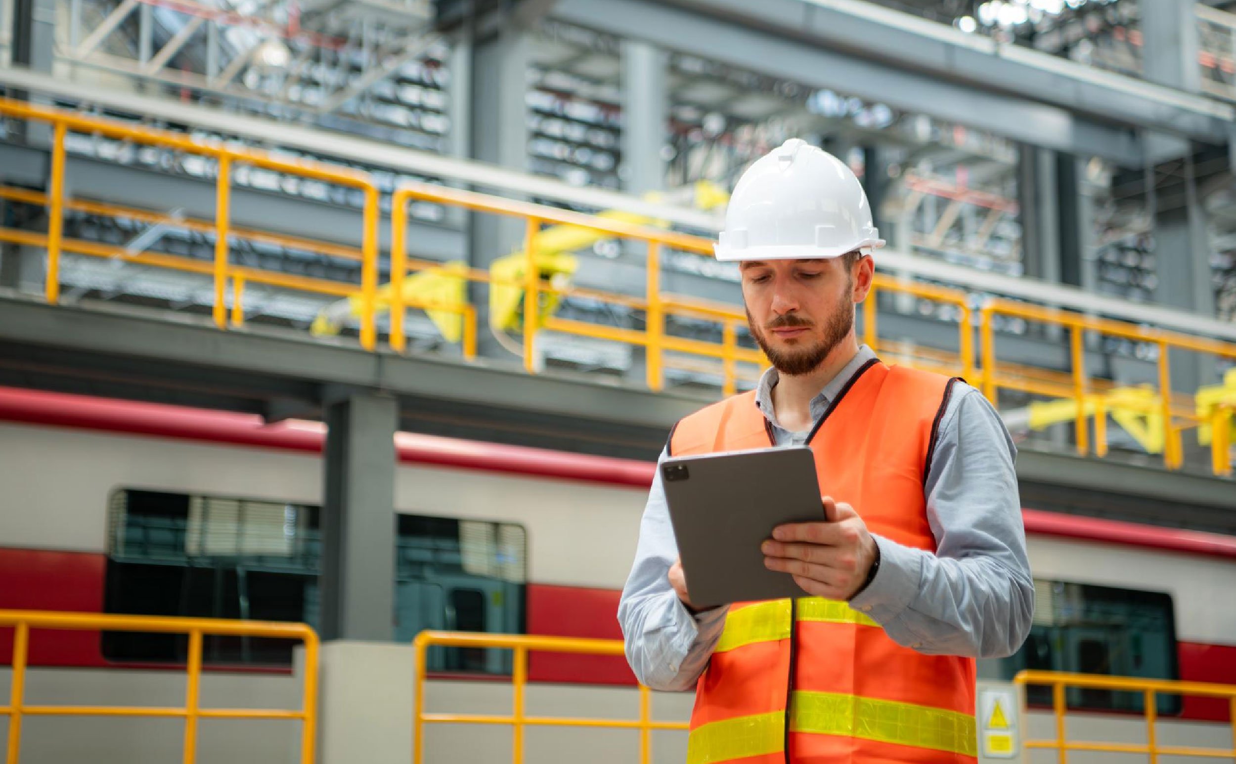 fda with cmms technician using tablet standing skytrain repair