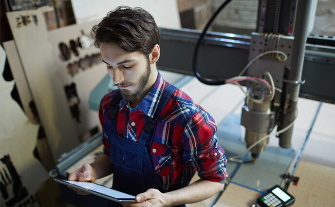 industrial preventive maintenance checklist technician working with tablet in factory
