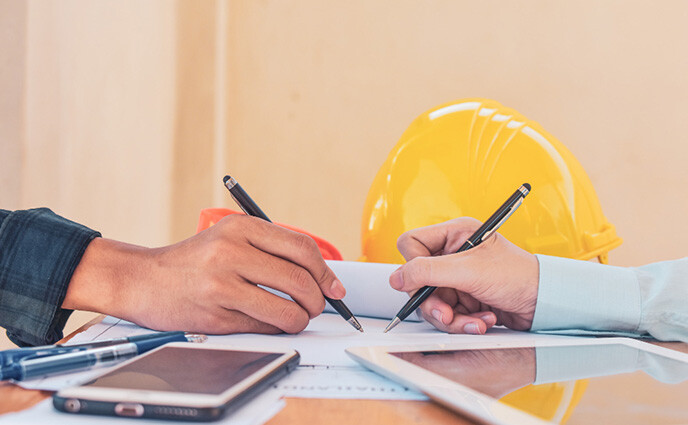 maintenance contracts zoomed in hands signing paper