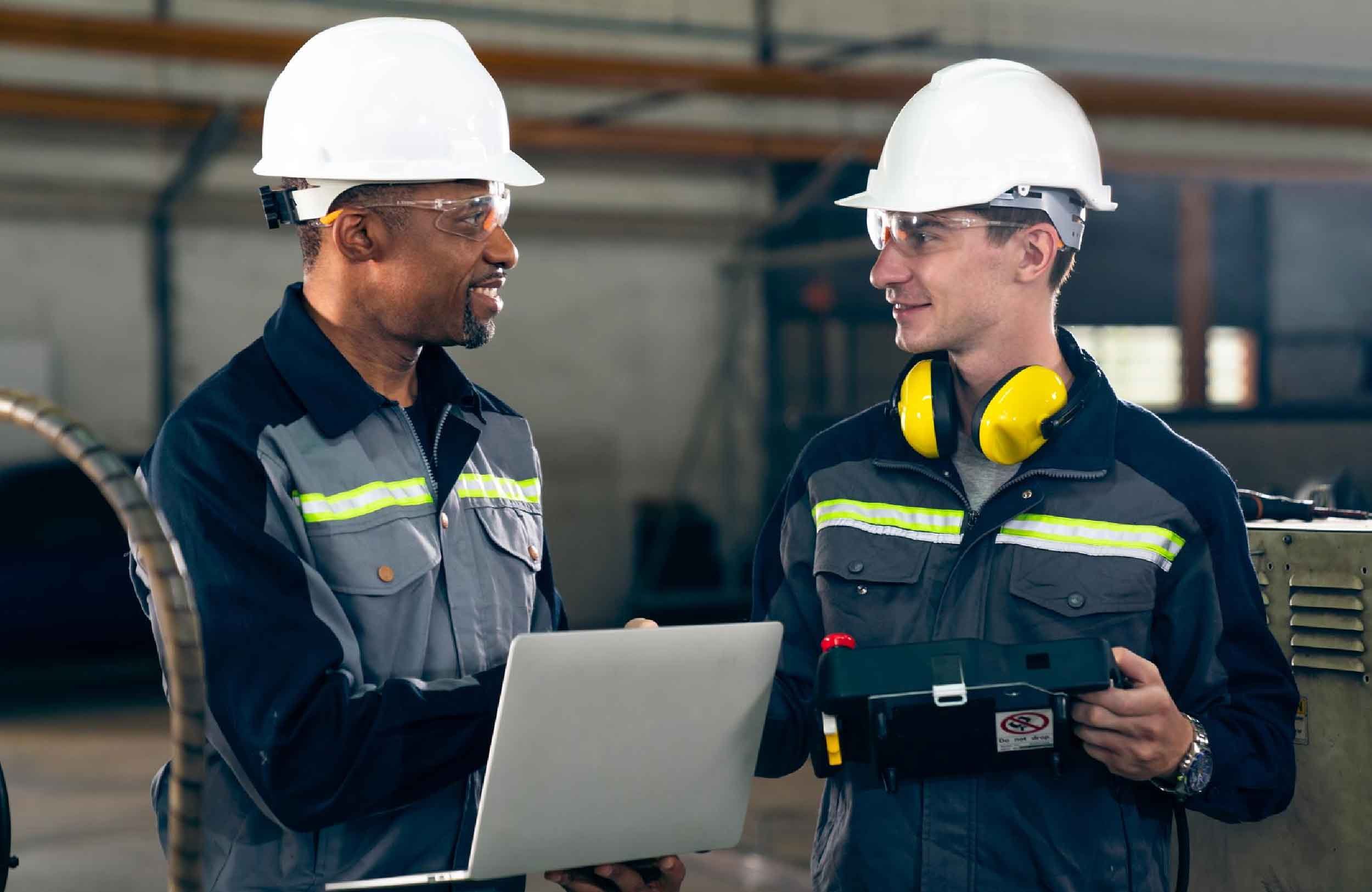 maintenance management success two factory workers using adept machine equipment workshop