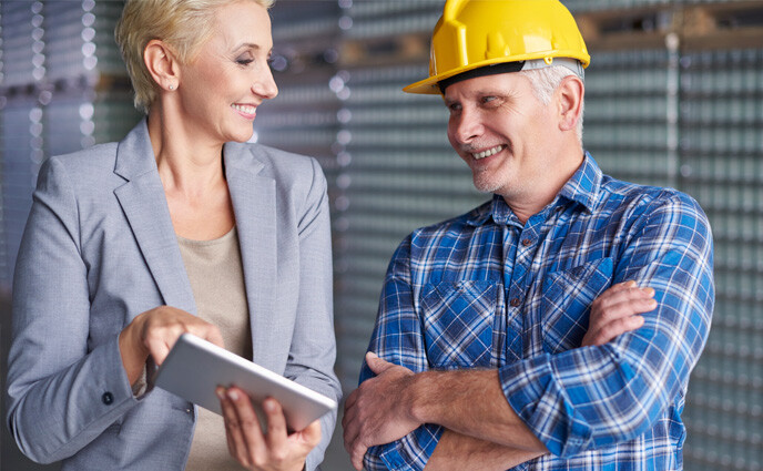 cmms maintenance outsourcing two maintenance professionals talking