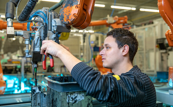 maintenance repair and overhaul technical worker performs maintenance robotic arms