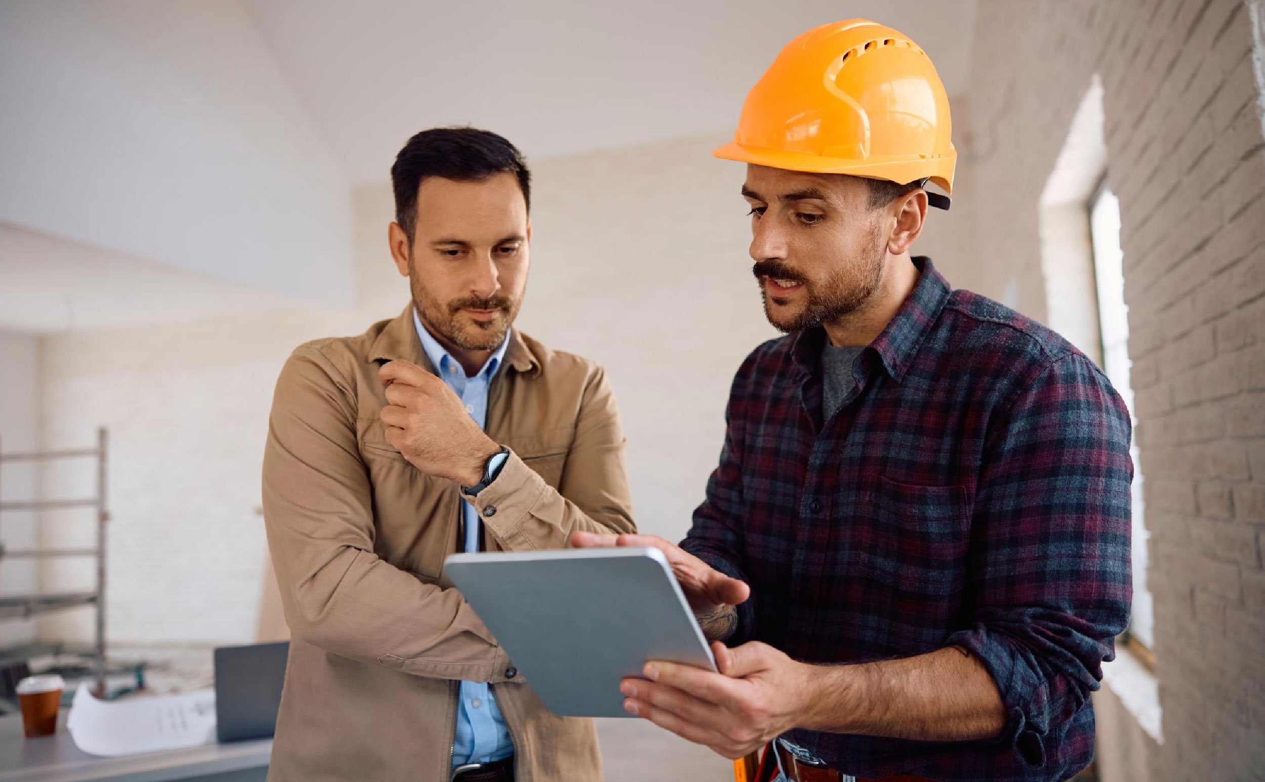 maintenance work order backlog building contractor and techinician discussing work