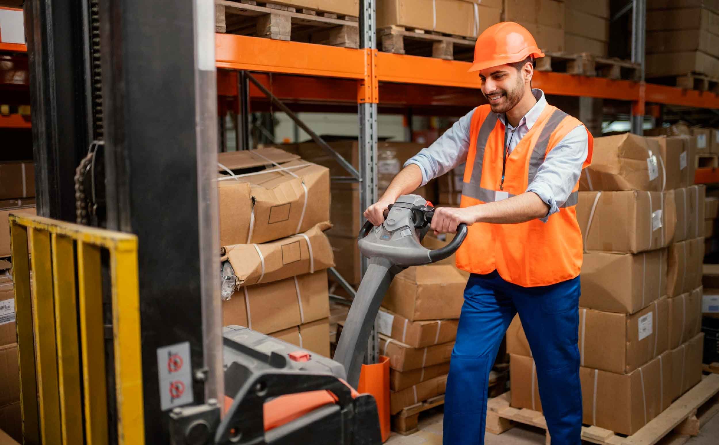 man in warehouse with forklift maintenance checklist