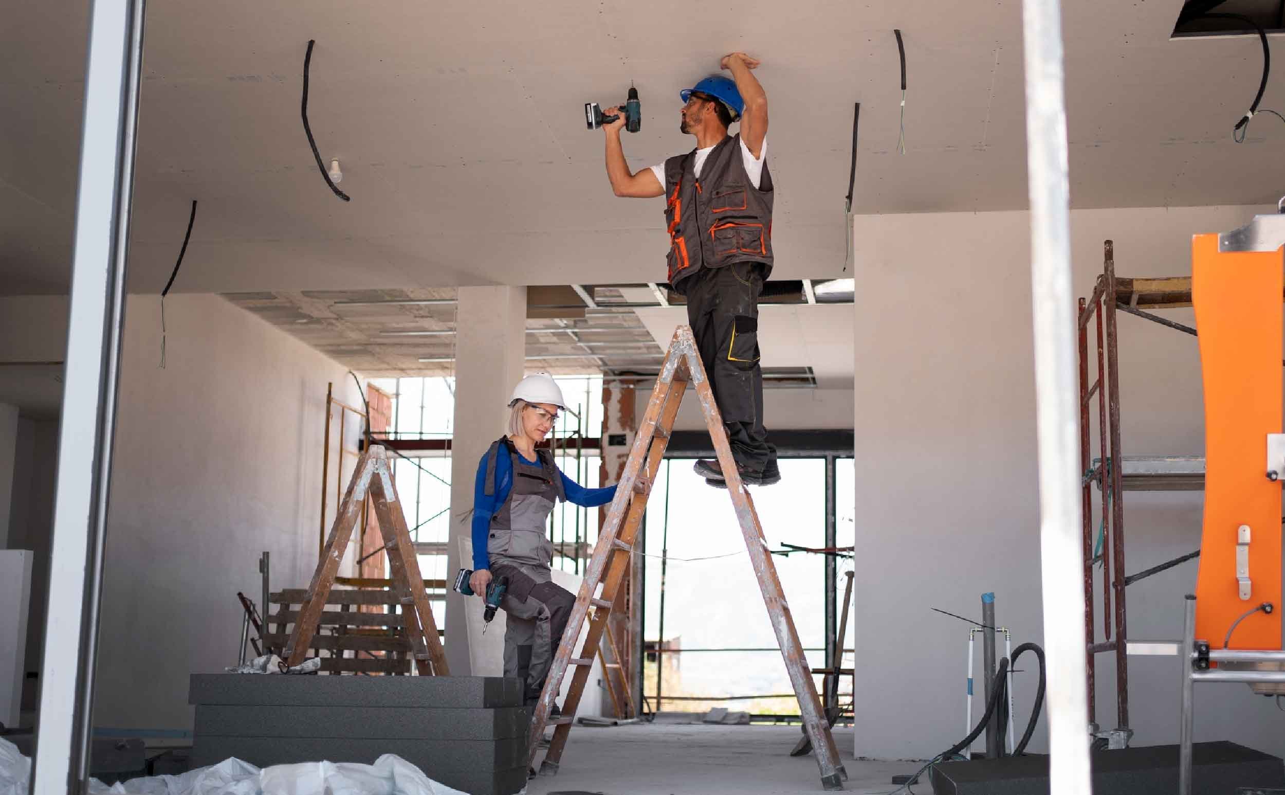 man woman standing ladder man woman standing ladder