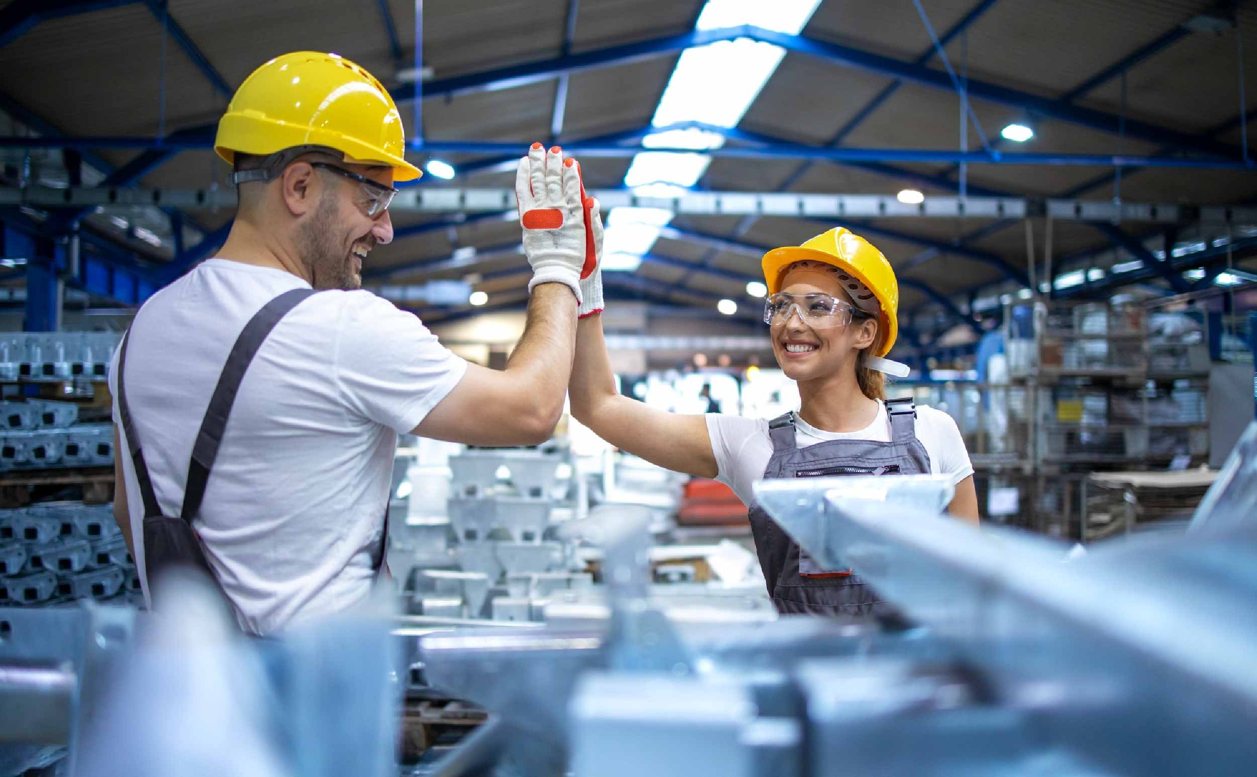 manufacturing downtime fixes factory workers greeting each other successful teamwork