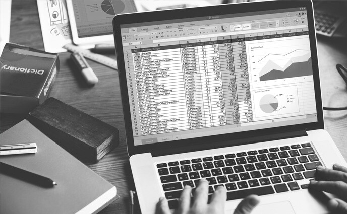 microsoft excel to cmms grey image of excel sheet laptop screen