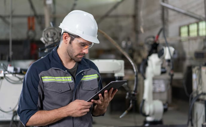 overall equipment effectiveness engineer using laptop