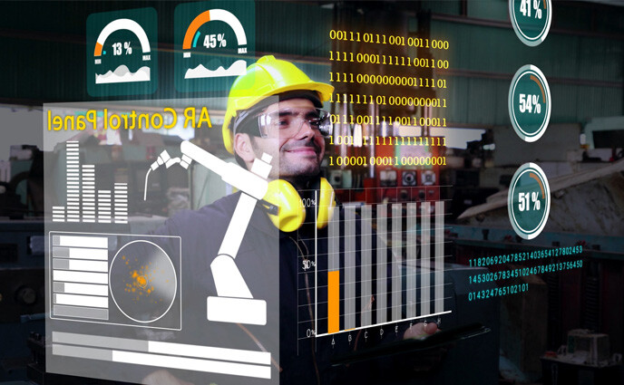 predictive maintenance enablement technician with analytics and data on screen