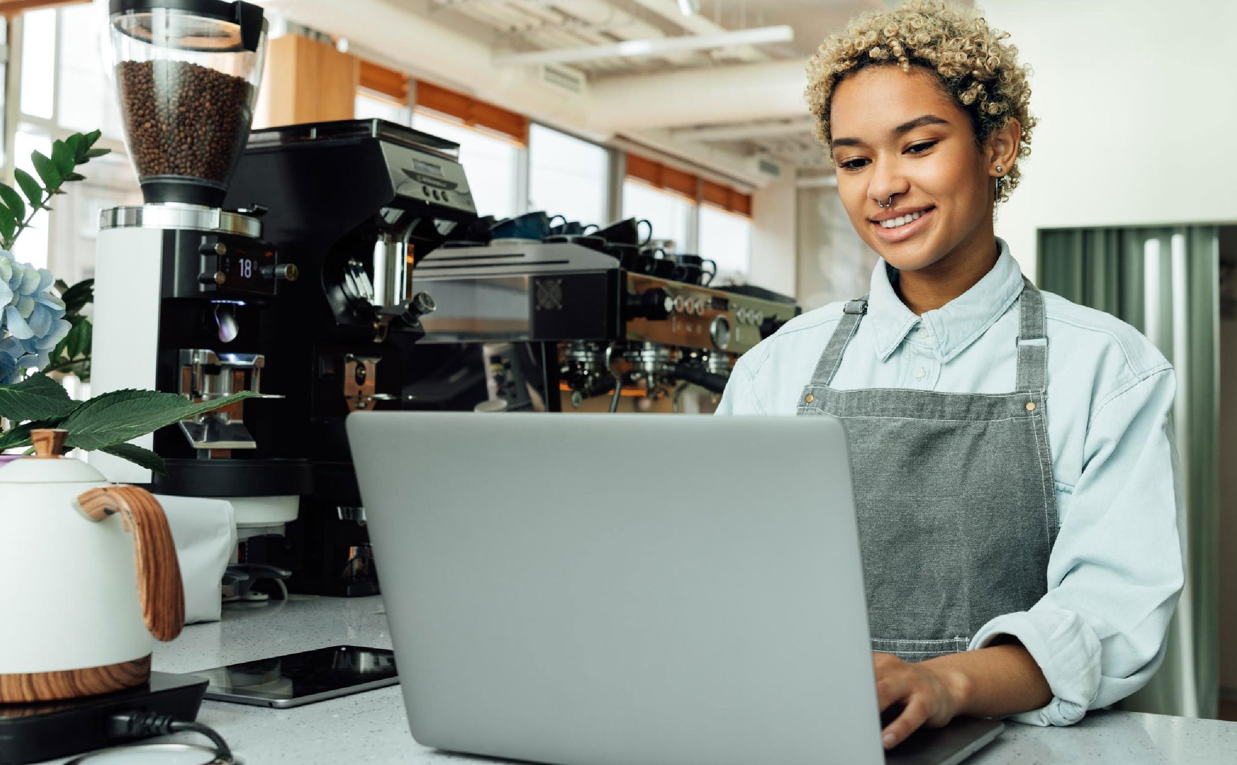 preventive maintenance software for small companies young woman using laptop in store