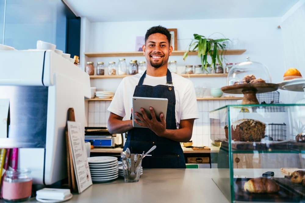 small business cmms cost savings barista working bar cafeteria