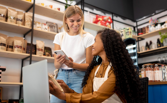 small business work order software women with devices in small shop