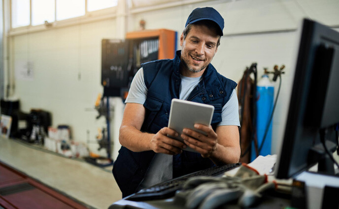 affordable cmms software technician using tab