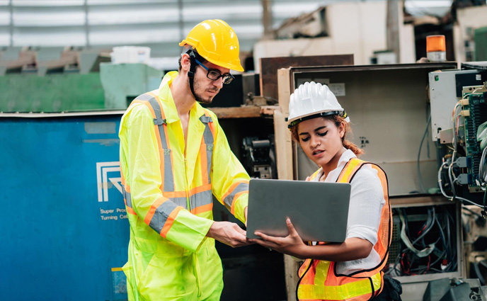 why maintenance management software engineers using laptop while standing factory