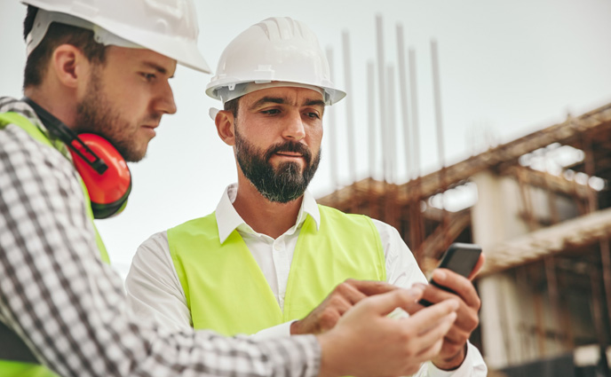 work order app architects hardhats using mobile app smartphone checking details