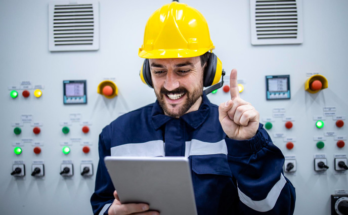 work order software gamification happy male engineer holding tablet